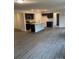 Open concept kitchen with island, dark cabinetry, and an eat-in area at 104 Springdale St, Shelby, NC 28150