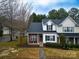 Townhouse with parking and surrounding trees at 12548 Hennigan Place Ln, Charlotte, NC 28214