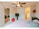 Bedroom with a queen-size bed, TV, and view of living room at 12548 Hennigan Place Ln, Charlotte, NC 28214