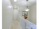 Upstairs hallway with carpet and a light fixture at 12548 Hennigan Place Ln, Charlotte, NC 28214