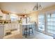 Efficient kitchen with white cabinets and island at 12548 Hennigan Place Ln, Charlotte, NC 28214