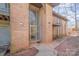 Brick apartment exterior with glass entryway and balcony at 133 Orchard Trace Ln # 7, Charlotte, NC 28213