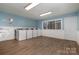 Community laundry room featuring multiple machines and wood-look flooring at 133 Orchard Trace Ln # 7, Charlotte, NC 28213
