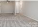 Open living room area with neutral paint and plush carpeting throughout at 133 Orchard Trace Ln # 7, Charlotte, NC 28213