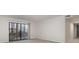 Bright living room featuring carpet flooring and a sliding glass door with access to outdoor space at 133 Orchard Trace Ln # 7, Charlotte, NC 28213