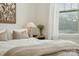 Bright bedroom with a cozy bed, neutral decor, and a large window at 330 Simeon Dr, Charlotte, NC 28208