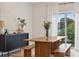 Modern dining room with wooden table and benches, and access to a balcony at 330 Simeon Dr, Charlotte, NC 28208