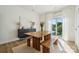 Modern dining room with wooden table and benches, and access to a balcony at 330 Simeon Dr, Charlotte, NC 28208