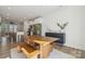 Modern dining room with wooden table and benches, open to the kitchen at 330 Simeon Dr, Charlotte, NC 28208