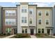 Three-story townhome with neutral siding and landscaping at 330 Simeon Dr, Charlotte, NC 28208