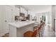 Modern kitchen with white cabinets, quartz countertops and island at 330 Simeon Dr, Charlotte, NC 28208