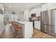 Modern kitchen with white cabinets, stainless steel appliances, and an island at 330 Simeon Dr, Charlotte, NC 28208