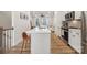 Modern kitchen with island, white cabinets and stainless steel appliances at 330 Simeon Dr, Charlotte, NC 28208