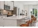Modern kitchen with white cabinets, quartz countertops and island at 330 Simeon Dr, Charlotte, NC 28208