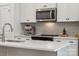 Modern kitchen features white cabinets, stainless steel appliances, and a stylish backsplash at 330 Simeon Dr, Charlotte, NC 28208
