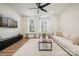 Bright living room boasts a comfy sofa, large windows, and hardwood floors at 330 Simeon Dr, Charlotte, NC 28208