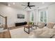 Spacious living room with hardwood floors, large windows and ceiling fan at 330 Simeon Dr, Charlotte, NC 28208