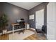 Dark-walled home office with wood floors at 330 Simeon Dr, Charlotte, NC 28208