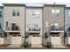 Rear view of townhouses with balconies and garages at 330 Simeon Dr, Charlotte, NC 28208