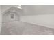 Attic bedroom featuring carpet, recessed lighting, a window, and angled ceiling at 3415 Waxhaw Indian Trail S Rd, Waxhaw, NC 28173