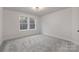 Carpeted bedroom with recessed lighting and a window provides an exterior view at 3415 Waxhaw Indian Trail S Rd, Waxhaw, NC 28173