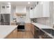 Well-equipped kitchen featuring stainless steel appliances, custom cabinets, and ample counter space at 3415 Waxhaw Indian Trail S Rd, Waxhaw, NC 28173