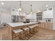 Bright kitchen features a spacious island with seating, stainless steel appliances, and modern pendant lighting at 3415 Waxhaw Indian Trail S Rd, Waxhaw, NC 28173