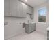 Laundry room featuring grey cabinets, marble floors, and a stainless-steel sink at 3415 Waxhaw Indian Trail S Rd, Waxhaw, NC 28173