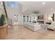 Open living room with fireplace, large windows, and modern finishes create a bright and inviting space at 3415 Waxhaw Indian Trail S Rd, Waxhaw, NC 28173