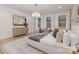 Serene main bedroom with large windows, neutral tones, and stylish furnishings at 3415 Waxhaw Indian Trail S Rd, Waxhaw, NC 28173
