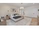 Spacious main bedroom features a cozy rug, modern chandelier, and access to the ensuite bathroom at 3415 Waxhaw Indian Trail S Rd, Waxhaw, NC 28173