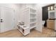 Mudroom with storage, bench seating, and access to a modern bathroom and an open pantry at 3415 Waxhaw Indian Trail S Rd, Waxhaw, NC 28173