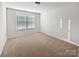 Well-lit bedroom with neutral walls and carpet at 3922 Townes Blvd, Terrell, NC 28682