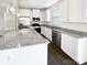 Modern kitchen with white cabinetry, granite countertops, and stainless steel appliances at 3922 Townes Blvd, Terrell, NC 28682