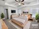 Virtually staged main bedroom with a neutral color scheme and king-size bed at 3922 Townes Blvd, Terrell, NC 28682