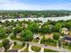 Stunning aerial view showcases a neighborhood near a pristine lake surrounded by lush greenery and distant mountains at 430 43Rd Nw Ave, Hickory, NC 28601