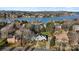 Stunning aerial view of a lakeside home, surrounded by trees and overlooking the serene waters and distant mountains at 430 43Rd Nw Ave, Hickory, NC 28601