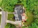 Aerial view of a well-maintained property featuring a lush lawn, mature trees, and landscaped gardens at 430 43Rd Nw Ave, Hickory, NC 28601