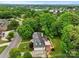 Aerial view of a home with lush trees, a lake in the distance and beautiful landscaping at 430 43Rd Nw Ave, Hickory, NC 28601
