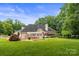 Expansive backyard featuring a well manicured lawn, mature trees, and an outdoor living area at 430 43Rd Nw Ave, Hickory, NC 28601