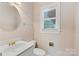 Small bathroom with white vanity and window at 430 43Rd Nw Ave, Hickory, NC 28601