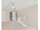 Cozy bedroom with ensuite bathroom, neutral carpet and paint, and a ceiling fan at 430 43Rd Nw Ave, Hickory, NC 28601
