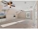 Expansive bedroom with multiple windows, ceiling fans, and built-in window seats at 430 43Rd Nw Ave, Hickory, NC 28601