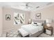 Staged bedroom with neutral colors, a comfortable bed, side tables, and a large window with natural light at 430 43Rd Nw Ave, Hickory, NC 28601