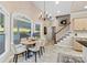 This dining area offers a large window for natural light and a staircase to access the second floor at 430 43Rd Nw Ave, Hickory, NC 28601
