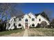 Elegant two-story home with a symmetrical design, manicured landscaping, and a brick walkway at 430 43Rd Nw Ave, Hickory, NC 28601