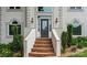 Close-up of front door with brick steps and manicured landscaping creating a welcoming entrance at 430 43Rd Nw Ave, Hickory, NC 28601