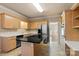 Bright kitchen features stainless steel appliances, tile floors, and a large island with a cooktop at 430 43Rd Nw Ave, Hickory, NC 28601
