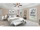 Staged bedroom with a comfortable bed, bench, and large windows showcasing natural light at 430 43Rd Nw Ave, Hickory, NC 28601