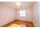 Charming bedroom with hardwood floors and floral wallpaper at 4745 16Th Street Ne Dr, Hickory, NC 28601